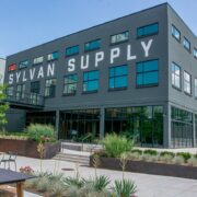 A building with the words sylvan supply on it.