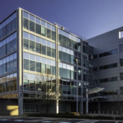 A building with many windows and glass on the outside.