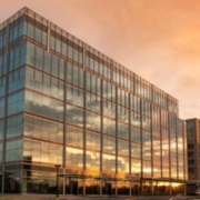 A building with many windows and a sky background