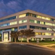 A building with many windows and lights on it