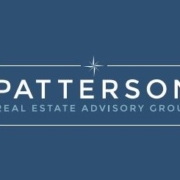 A blue background with the words patterson real estate advisory group in white.