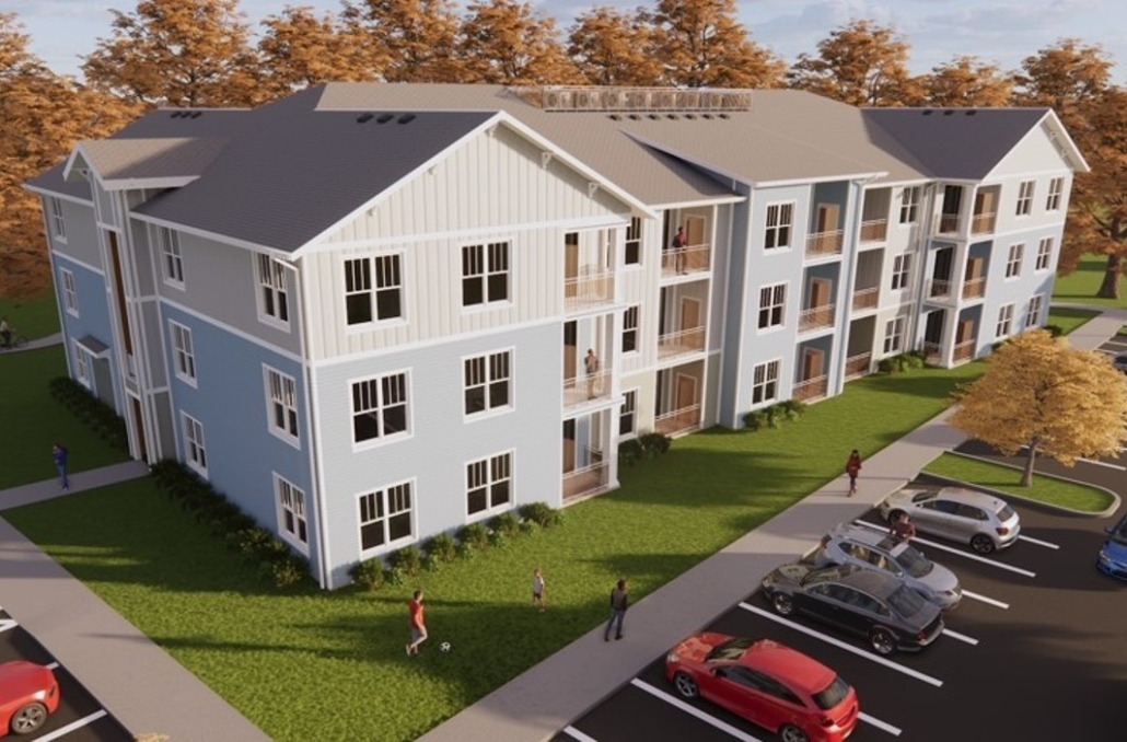 An aerial view of a building with cars parked in front.